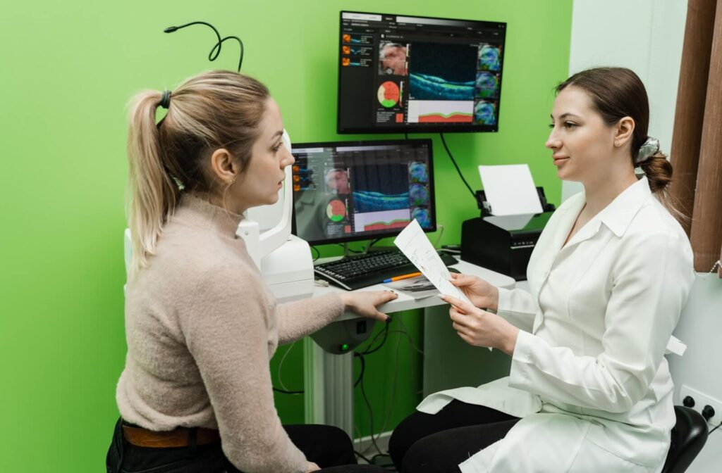An optometrist discusses the results of their patient's OCT scans.